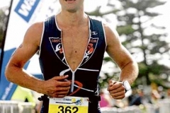 News-NCH. 18.03.12. Sparke Helmore triathlon. Olympic first place getter Luke Martin comes down the finish chute. picture by Brock Perks